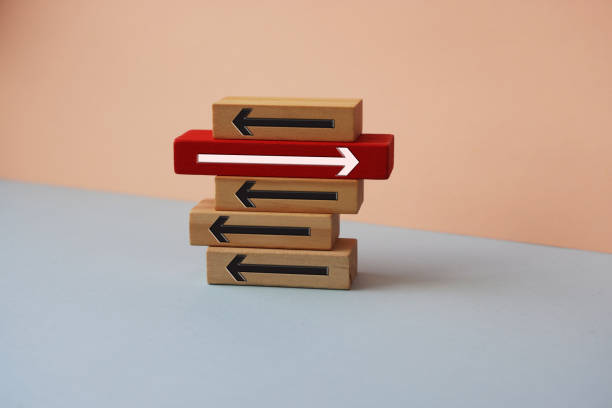 istock Wood block with arrow symbols. 1377603320