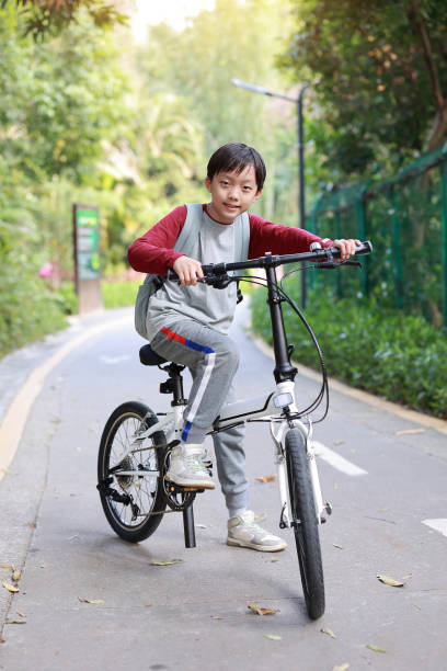istock Little boy riding bike 1377608265
