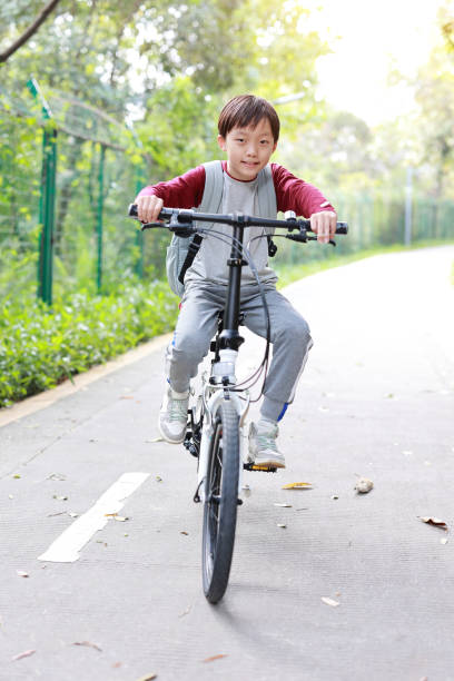 istock Little boy riding bike 1377608276