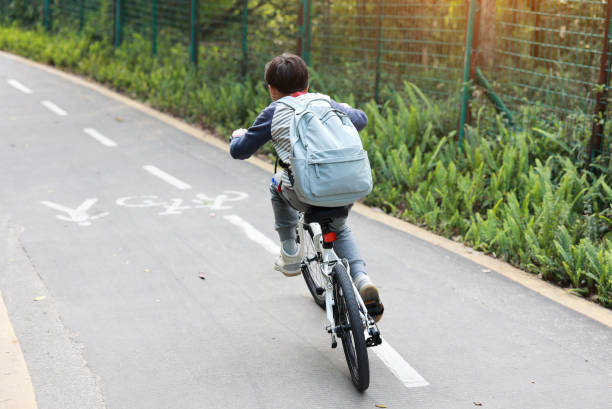 istock Little boy riding bike 1377608284