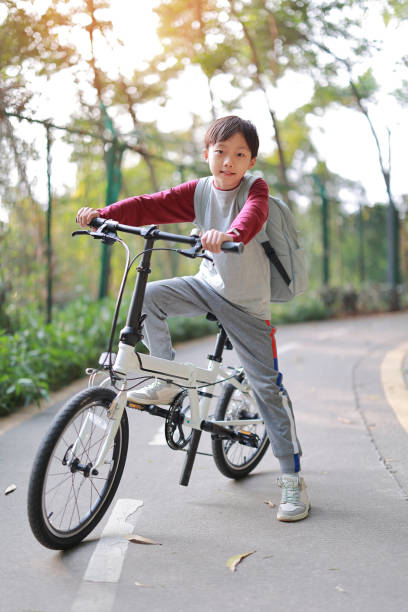 istock Little boy riding bike 1377609392