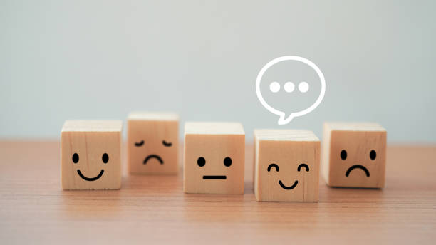 istock chat sign above smiling face on wood block cube with for satisfaction customer services best excellent business rating experience. satisfaction survey concept 1377616022