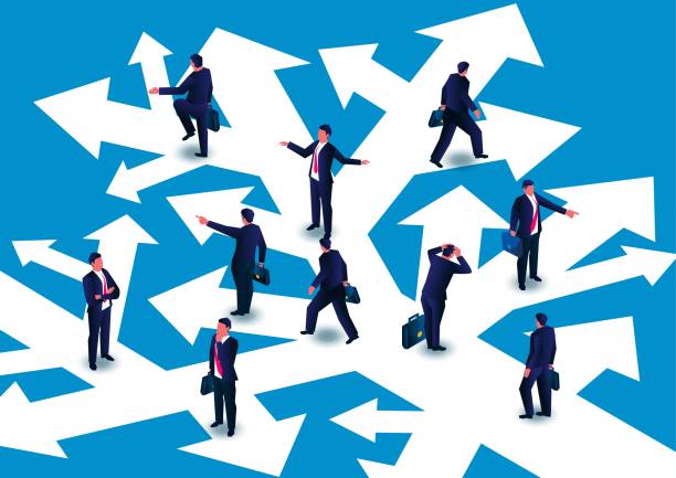 istock Confused group of businessmen looking for direction on chaotic road and direction 1377616469