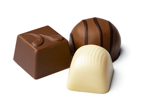 Chocolate sweets on a white background, close up