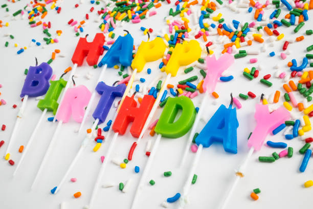 istock Happy Birthday Letter Candles on a White Background with Sprinkles 1377633657
