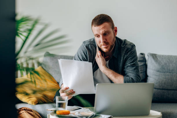 istock Work at Home: Handsome Business Man Having a Phone Call at Home 1377636704