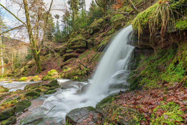 istock Beautiful mountain waterfall in a wild and isolated valley during the winters. 1377641093