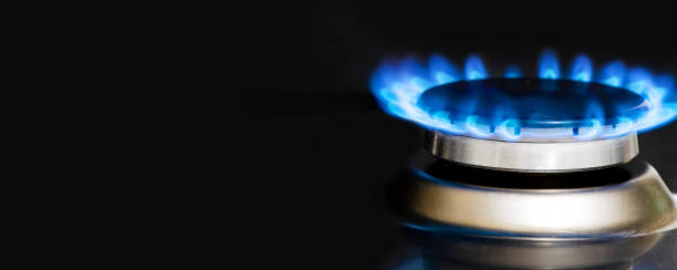istock A burning gas stove. Black background. Copy space 1377642148