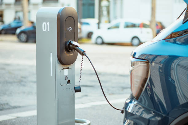 Electric cars on chargers stock photo