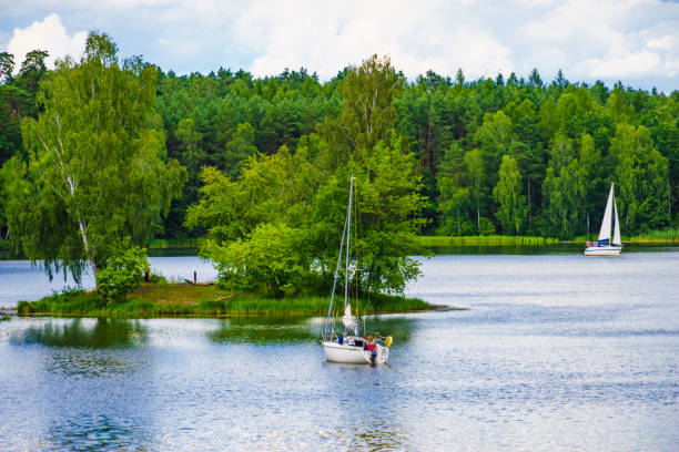 Boat yachts on lake during summer. Tuchola national park in Poland. Yachting, holidays concept.
