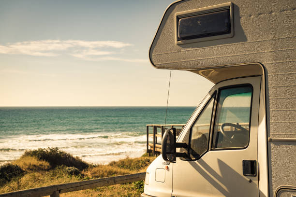 istock Camper rv camping on sea shore, Spain 1377665989