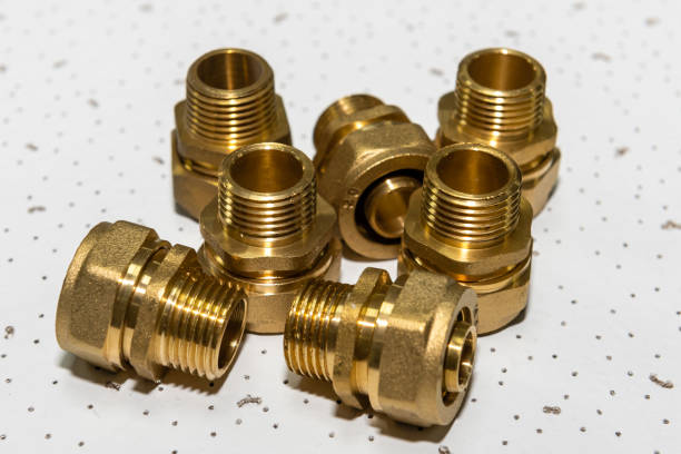 istock Plumbing fittings for water pipe on white textured background 1377681770