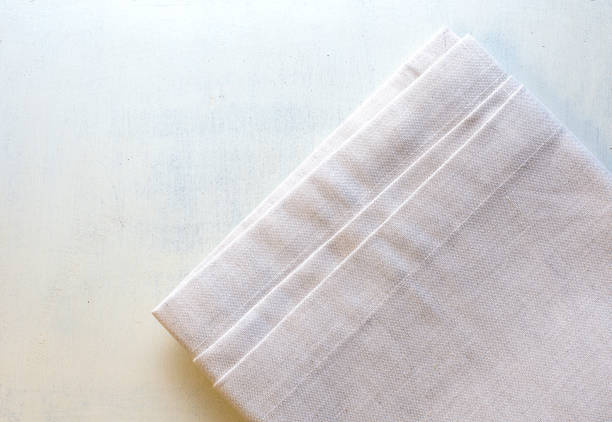 istock Napkin close-up on a wooden background. Copy space 1377710583