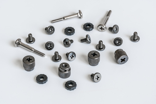 Close up of metal screws on white background