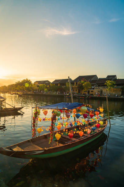 Lantern boat on Thu Bon river of ancient town Hoi An Lantern boat on Thu Bon river of ancient town Hoi An in sunset, Quang Nam province, Vietnam. thu bon river stock pictures, royalty-free photos & images