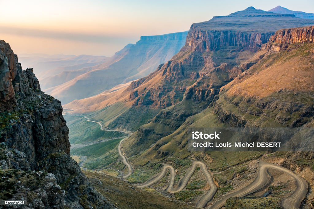 Lesotho picture The winding Sani Pass dirt road between South Africa and Lesotho Drakensberg Mountain Range Stock Photo