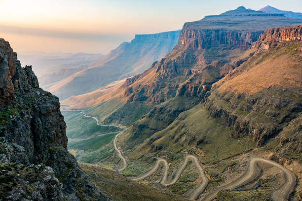 Lesotho picture The winding Sani Pass dirt road between South Africa and Lesotho drakensberg mountain range stock pictures, royalty-free photos & images