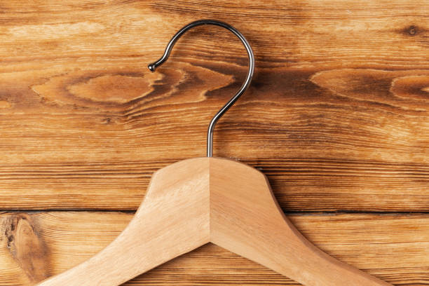istock Composition with clothes hangers on wooden background. 1377737840