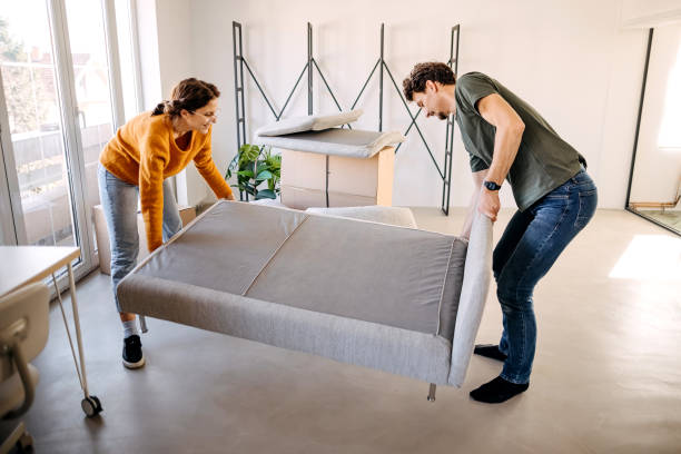 istock Young couple assembling bed in new house 1377772374