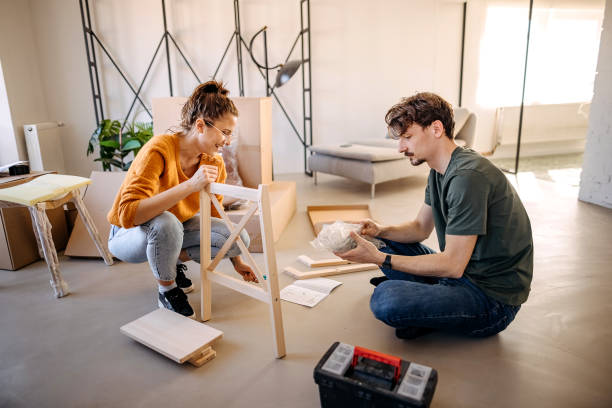 istock Loving couple assembles a chair together 1377772941