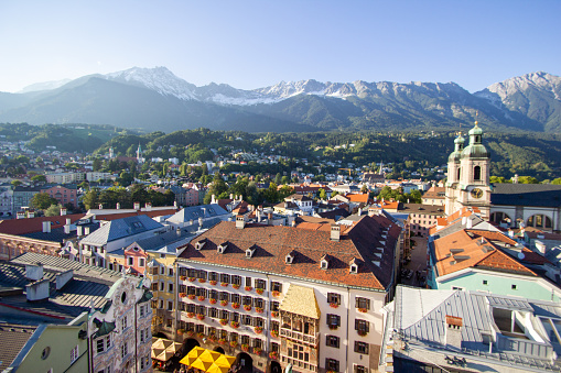 Innsbruck Austria - September 14th 2012: Innsbruck cityscape aerial view from high-up with alps in the background