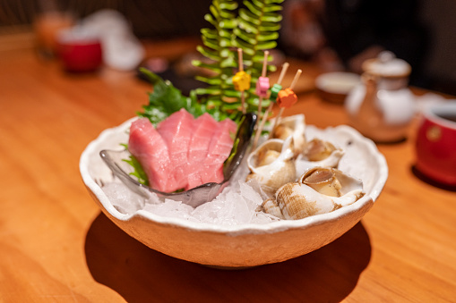 Tasty Japanese cuisine Tuna and Conch Sashimi in the restaurant in Guangdong.