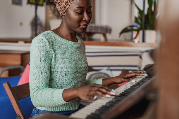istock Woman playing a piano 1377802235