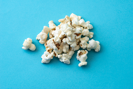 Close-Up Of Popcorn Against a blue Background