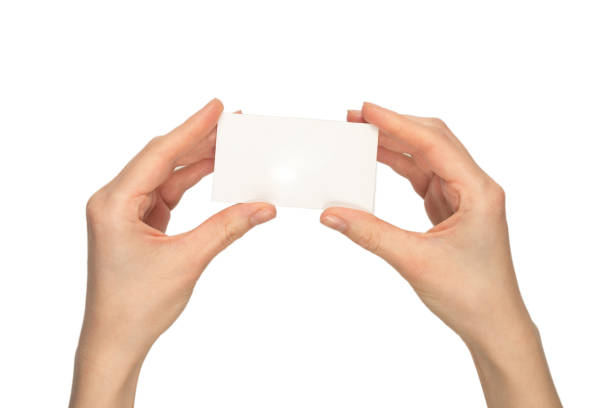 istock Empty card in woman hand  isolated on white background. 1377809565