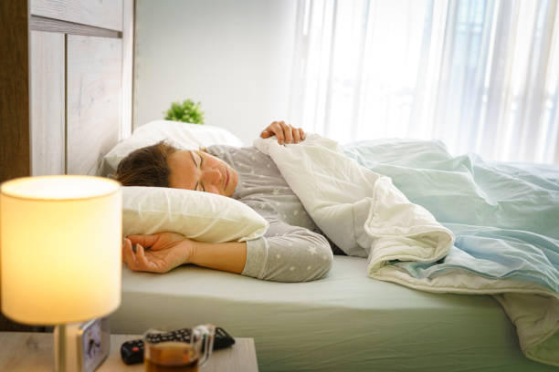close up woman sleep in white bed