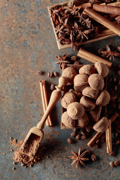istock Chocolate truffles and spoon with cocoa powder. 1377833018