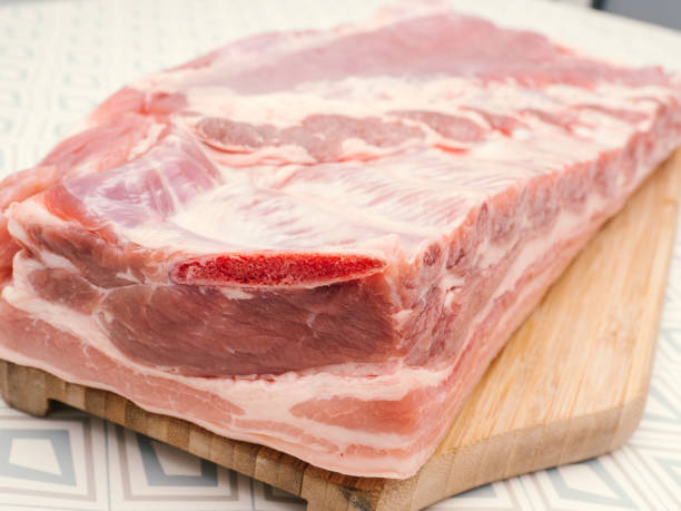 istock Raw pork meat on a cutting board. Raw meat 1377852455