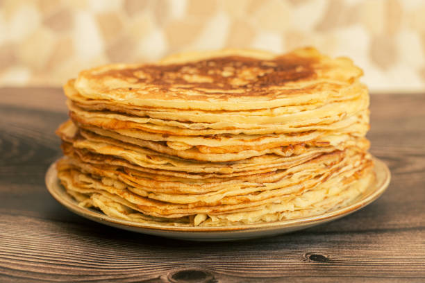 istock Delicious pancakes with chocolate sauce fresh blueberries on a rustic wooden table. Rustic brown table. 1377875463