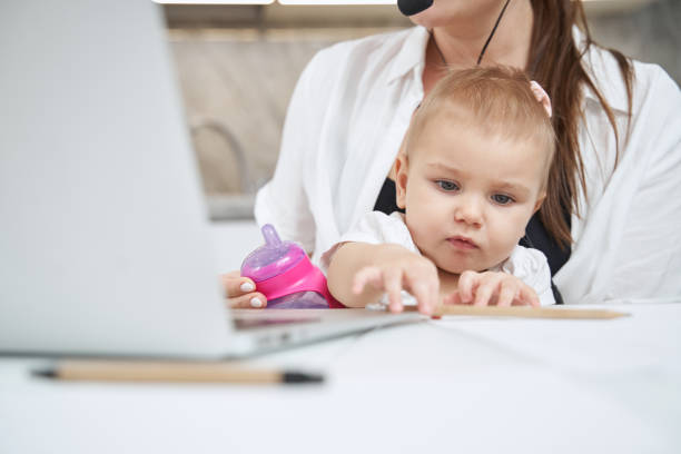 istock Baby reaching out and taking pencil from table 1377876562