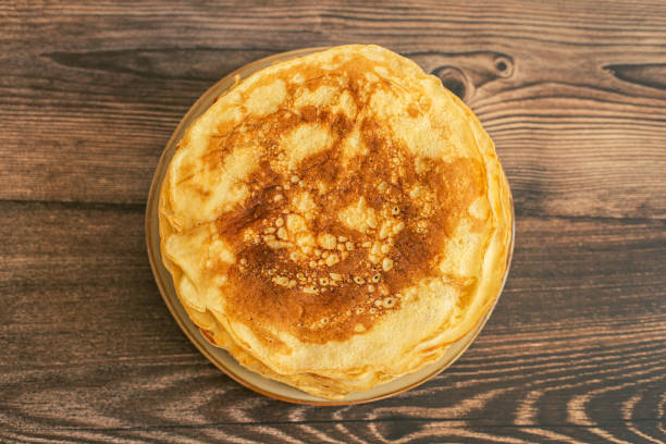 istock Delicious pancakes with chocolate sauce fresh blueberries on a rustic wooden table. Rustic brown table. 1377881401