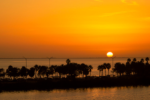 Sunrise or sunset with reflection of sun over the sea