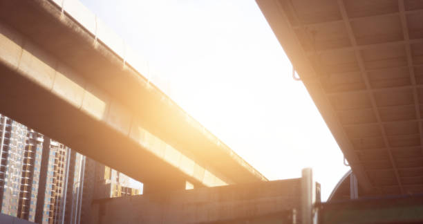 istock low angle view of highway overpass with sun 1377913167