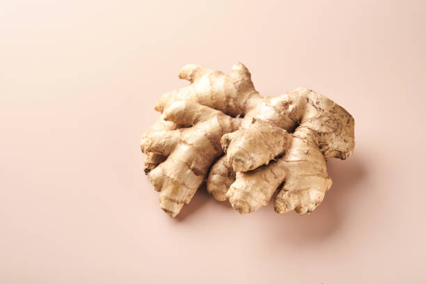 istock Ginger root. Fresh ginger root on a beige background. Vitamins. Virus-protecting products. Top view. Free space for your text. 1377931625