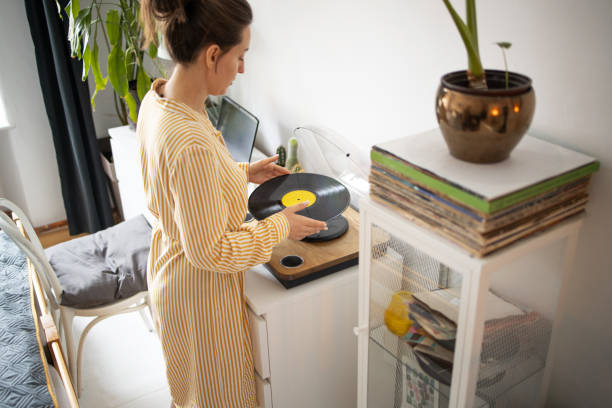 istock Young woman Playing vinyl records 1377944774