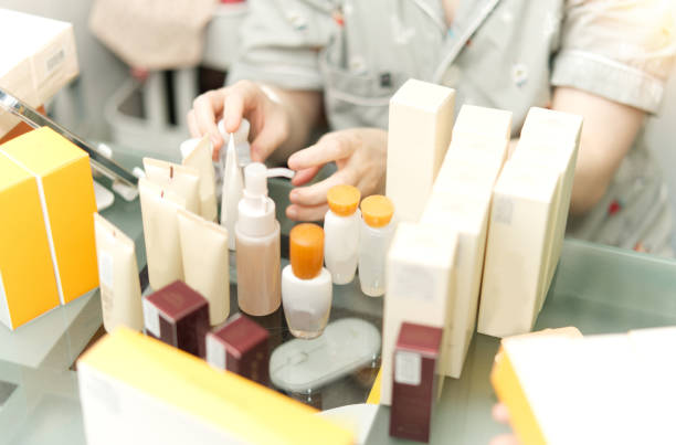 cosmetic products on table with woman