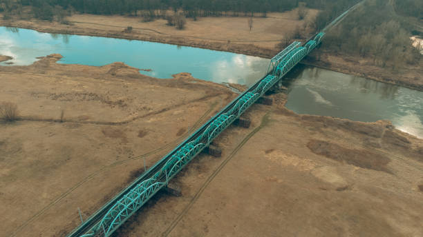 istock Blue railway bridge over the river Oder, Scinawa, Poland.  City view area drone photo 1377949909