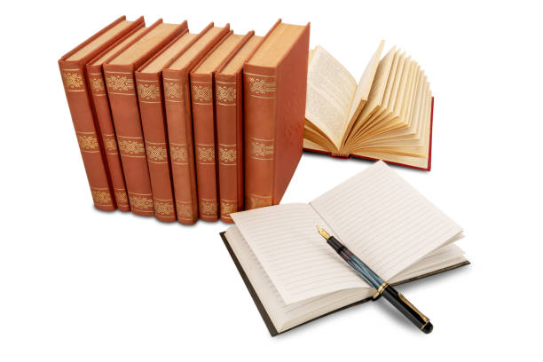 lined notebook with old fountain pen with old book