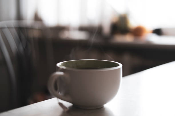 istock cup of hot drink on the table with aromatic steam 1377996601
