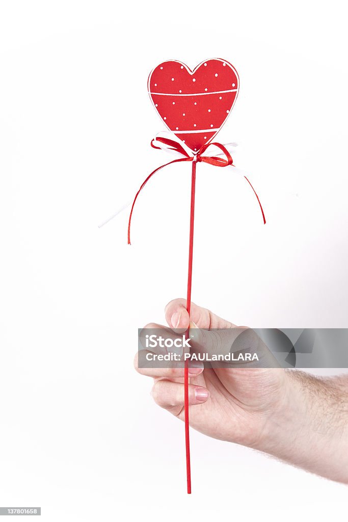 Man giving a heart man holding beautiful heart on a stick Adult Stock Photo