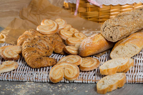 istock Wheat and grain baguettes, croissants and biscuits on wicker mat 1378027067