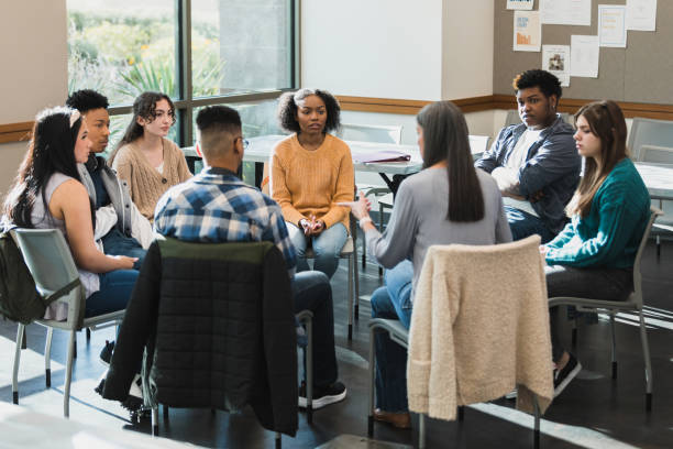 istock Female therapist leads session with troubled high school students 1378027628