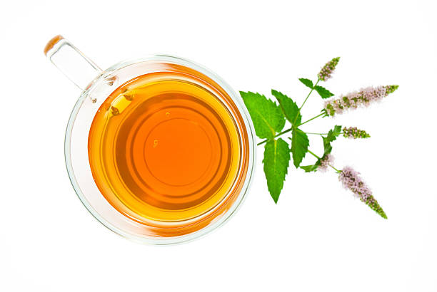 istock Glass of tea and peppermint flowers 137803549