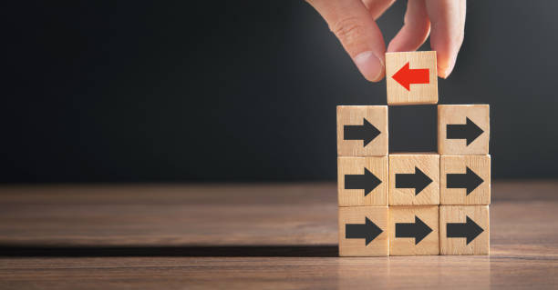 istock Red arrow opposite to black arrows direction. 1378045126