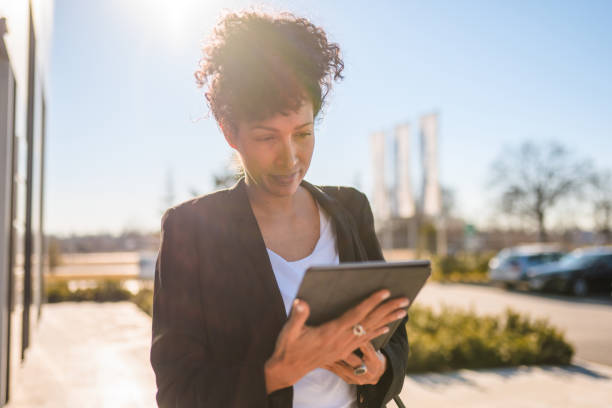 istock A Mature Spanish Businesswoman Using A Digital Tablet 1378051583
