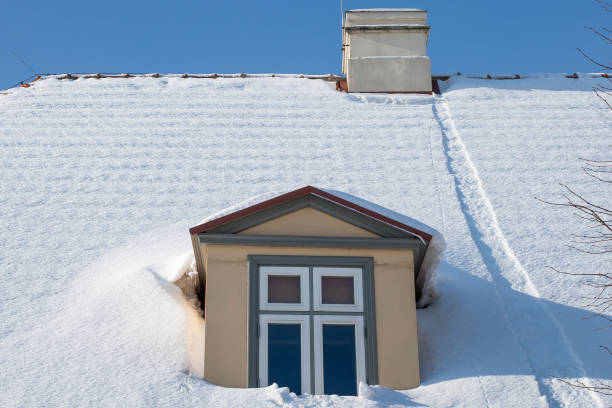 istock snow-covered house roof 1378060542